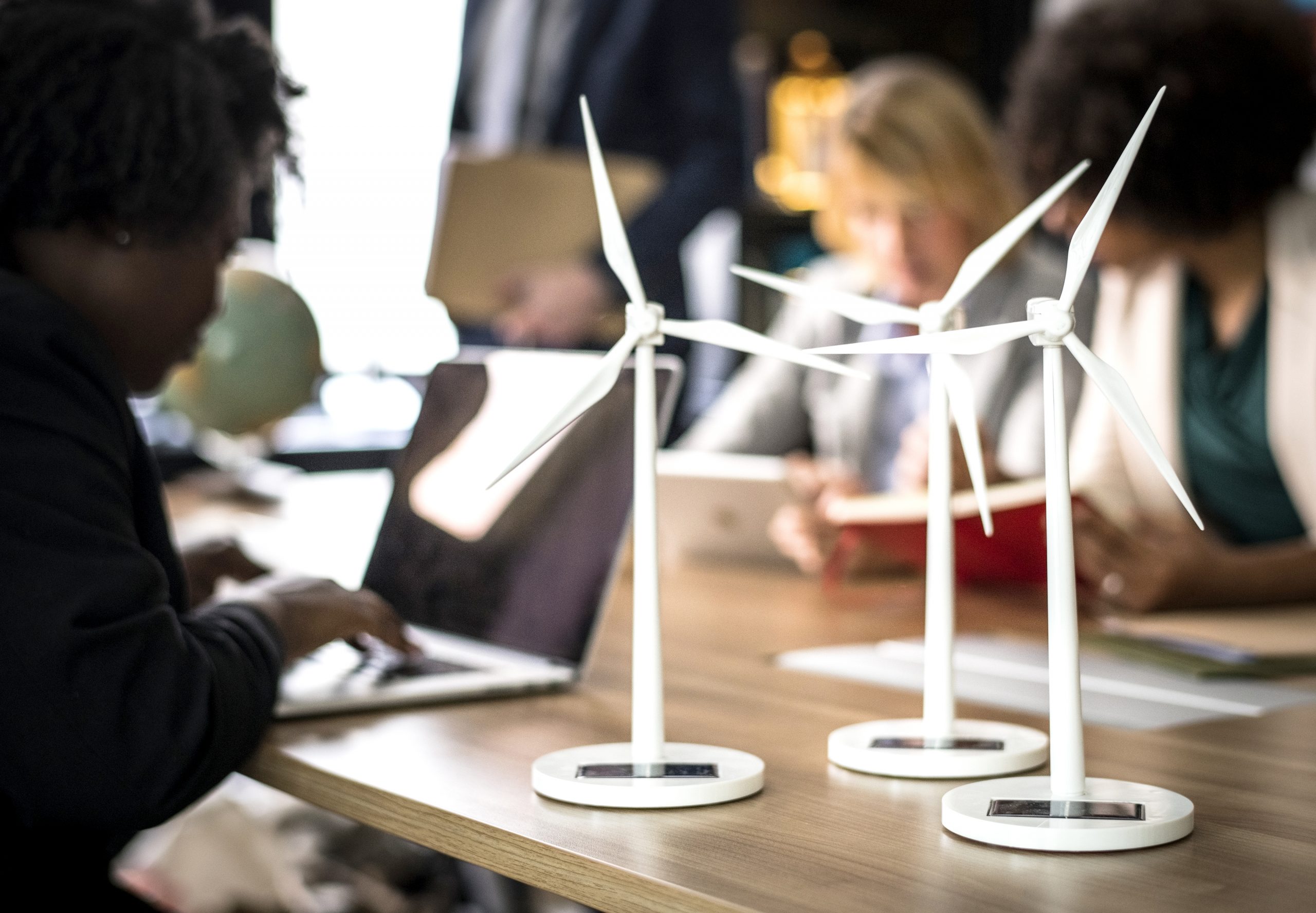 Windmill models on a meeting table Windmill models on a meeting table